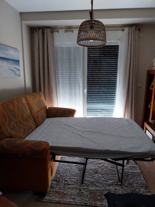 Sofá cama tela naranja y beige