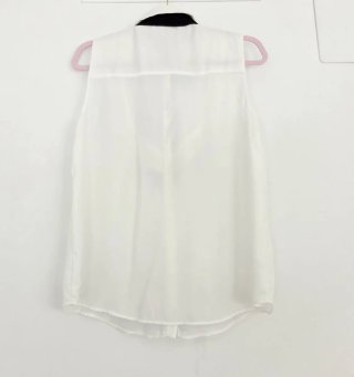 Blusa Zara sin mangas con lazada negra