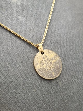 Medalla espantapájaros acero chapado oro