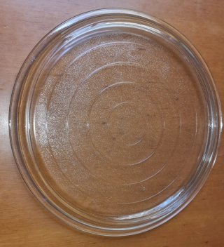 Piatto rotondo in vetro trasparente