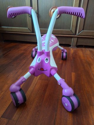 Triciclo morado para niños
