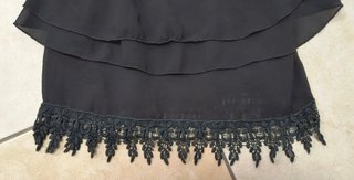 Top TANK nero con spalline e balze