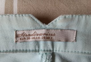 Pantalones verdes tobilleros con cremallera