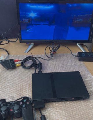 PlayStation 2 Slim + Gioco e accessori