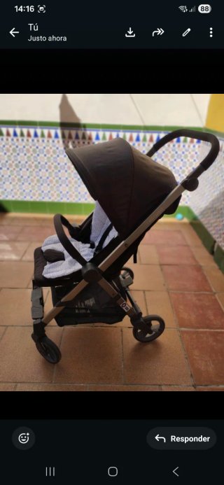 Carrito de bebé con funda y saco