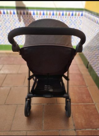 Carrito de bebé con funda y saco