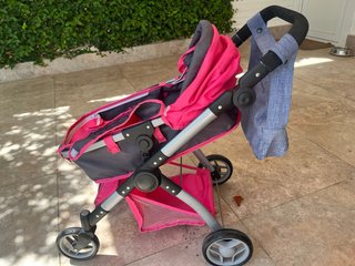 Cochecito de muñecas rosa y gris