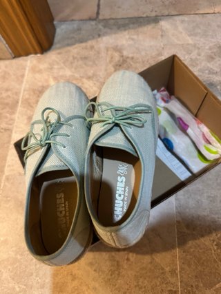 Zapatos planos teal puestos una vez