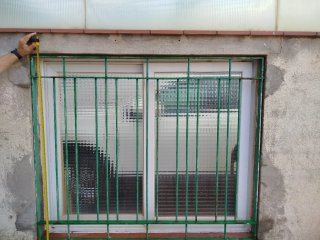 Ventana corredera con reja