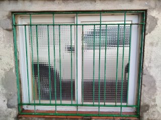 Ventana corredera con reja
