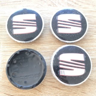 TAPABUJES SEAT 56mm NEGROS - EMBLEMA LLANTAS SEAT