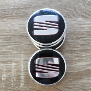 TAPABUJES SEAT 56mm NEGROS - EMBLEMA LLANTAS SEAT