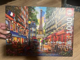 2 Puzzles Ravensburger y Educa: París y Alicia