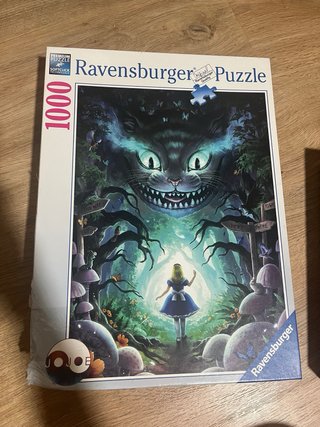 2 Puzzles Ravensburger y Educa: París y Alicia