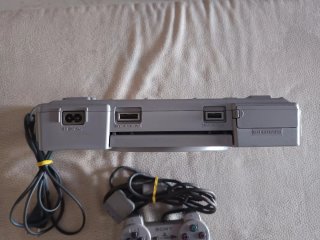 PlayStation 1 Sony Silver con joystick