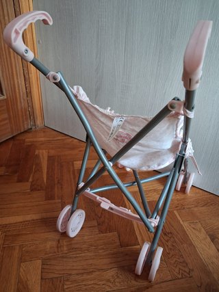 Carrito de muñecas rosa
