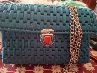 Bolso de mano tejido color verde azulado