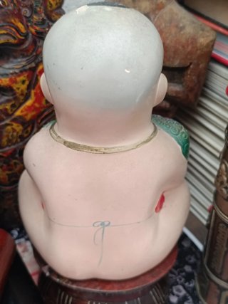 Figura alcancía china niño con león