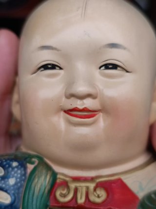 Figura alcancía china niño con león