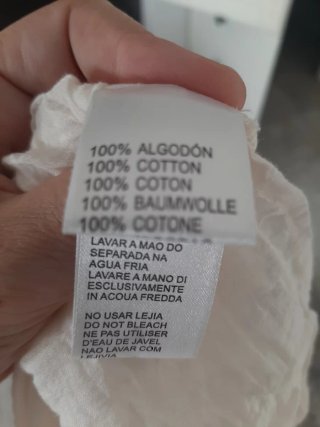 Vestido tirantes beige bordado por delante.
