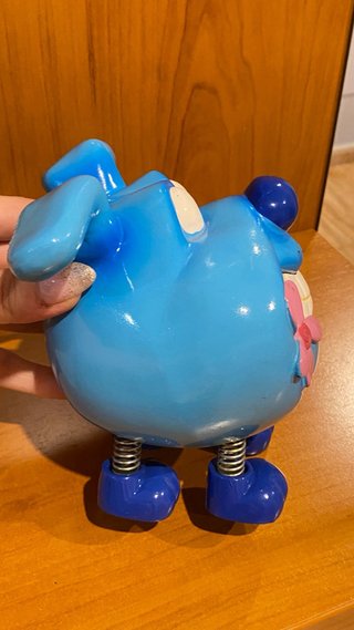 Hucha azul con flor rosa