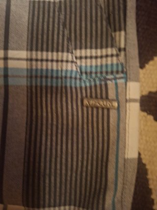 Pantalón corto Rip Curl Talla 34,nuevo prácticamen