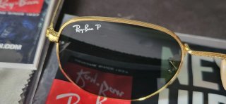 Gafas de sol Ray-Ban doradas y negras