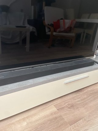 Mueble TV gris y blanco con cajón