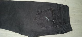 Pantalones vaqueros grises con cremallera