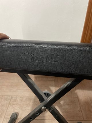 Asiento de piano negro plegable
