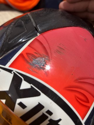 Casco de moto X-lite naranja y azul