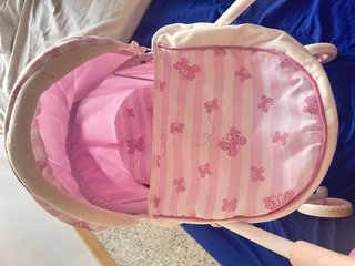 Carrito de muñecas rosa con capota