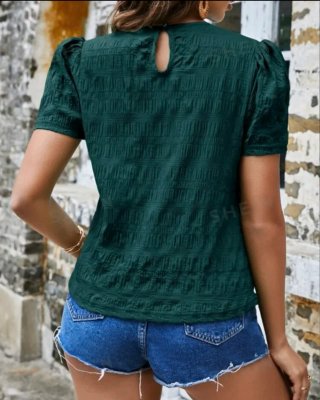 Blusa verde azulado con mangas abullonadas