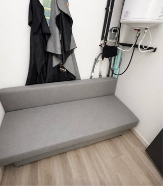 Sofá cama gris compacto
