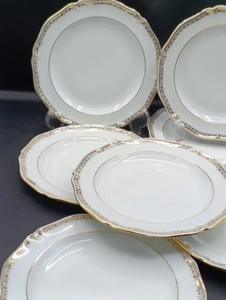 Conjunto de 7 platos de porcelana dorados