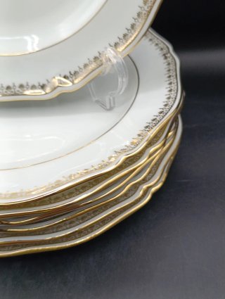 Conjunto de 7 platos de porcelana dorados