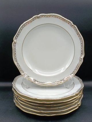 Conjunto de 7 platos de porcelana dorados