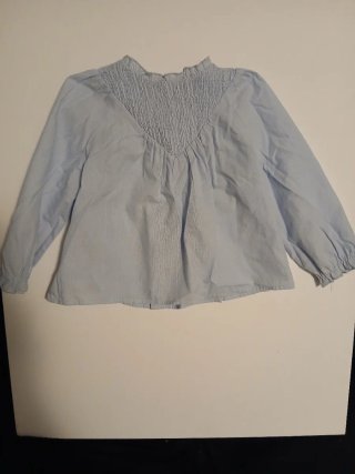 Blusa azul niña cuello volante
