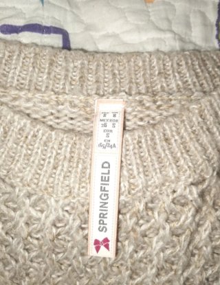 Jersey de punto beige con detalles