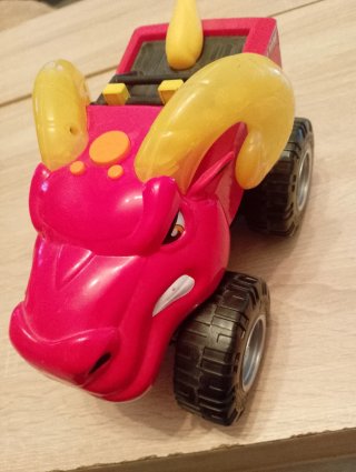 Coche de juguete monstruo rojo y amarillo