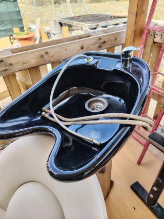 Silla y lavabo peluquería