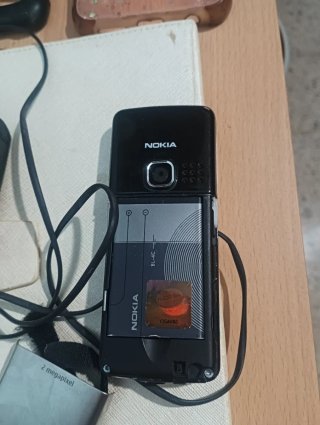 Lote móvil Nokia, cargador y fundas