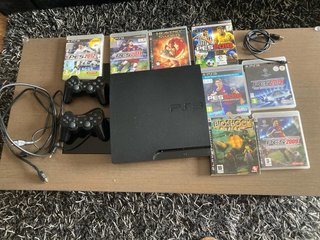 PS3 (PlayStation 3) Nera + 8 Giochi e 2 Controller