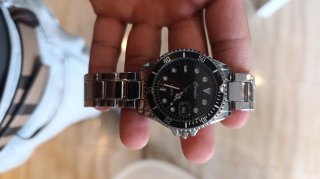 Reloj de pulsera verde y plateado venta x unidad.