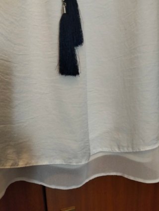 Blusa blanca,Cya, sin mangas con collar.