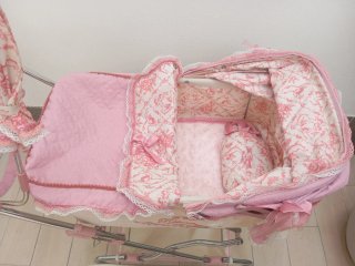 Cochecito de muñecas rosa