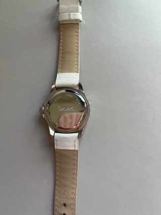 Reloj SELECT blanco y plateado
