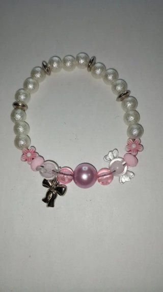 Pulsera artesanal perlas y dijes
