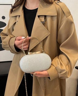 Bolso de fiesta plateado y dorado con lazo