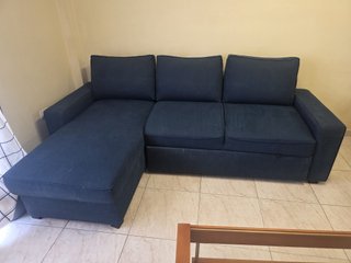 Sofá cama azul con almacenaje